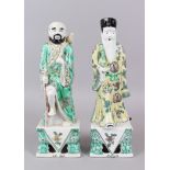 A PAIR OF CHINESE FAMILLE VERTE IMMORTALS. 13cm high.