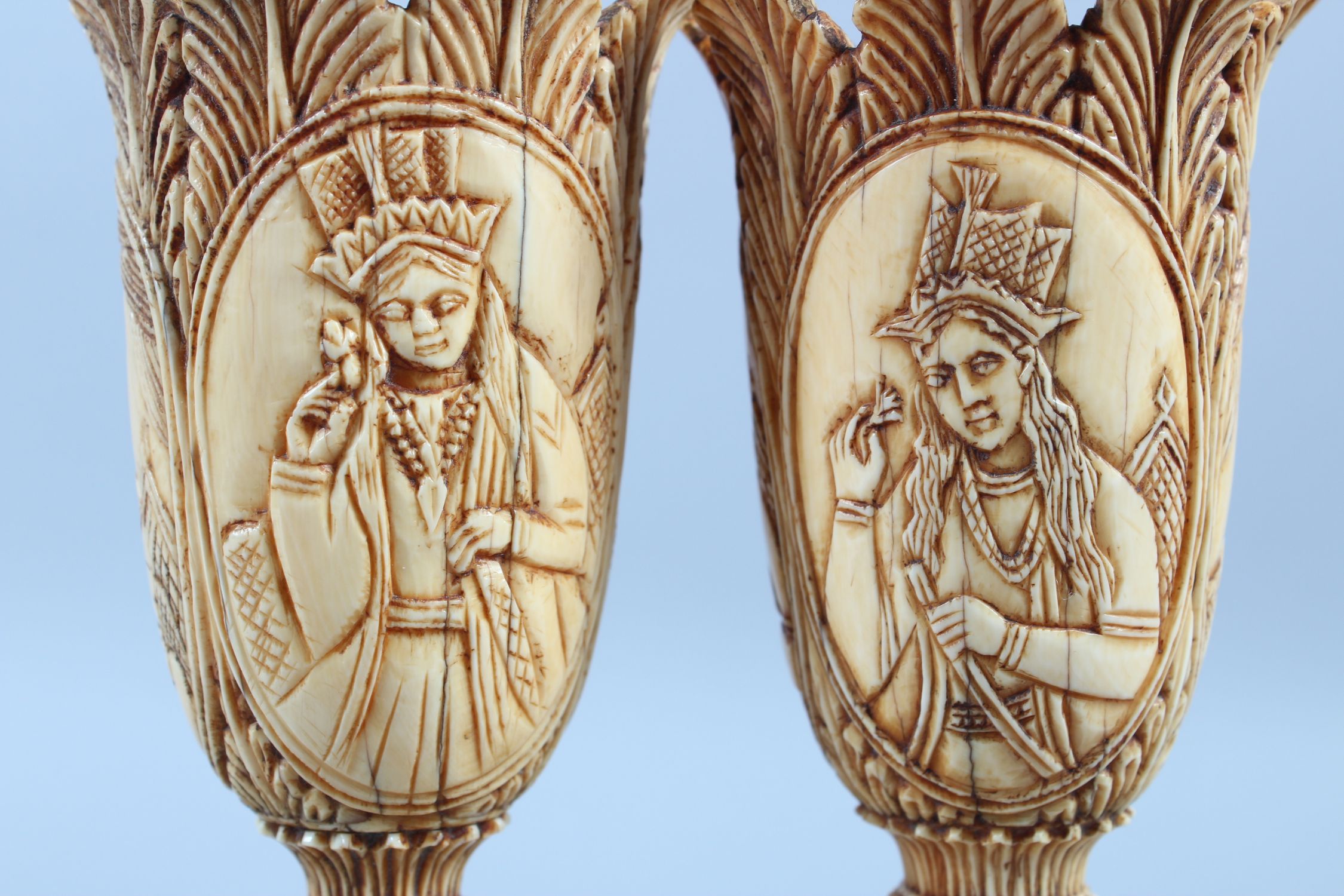 A PAIR OF 19TH CENTURY INDIAN CARVED IVORY TULIP SHAPED VASES, depicting Mughal rulers and consorts, - Image 3 of 8