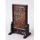 A GOOD CHINESE CARVED SOAP STONE UPRIGHT MINIATURE SCREEN, on a wooden stand ,10cm x 5cm.