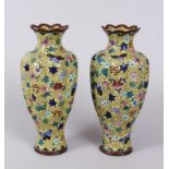 A PAIR OF JAPANESE YELLOW GROUND RIBBED` CLOISONNE ENAMEL VASES. 18cm high.