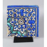 A PERSIAN QAJAR BLUE AND WHITE CORNER TILE, 19TH CENTURY, 21cm x 21cm.