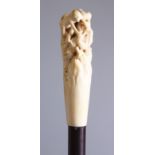 A GREAT QUALITY JAPANESE IVORY OKIMONO/WALKING STICK MONKEY GROUP, the carved handle depicting a