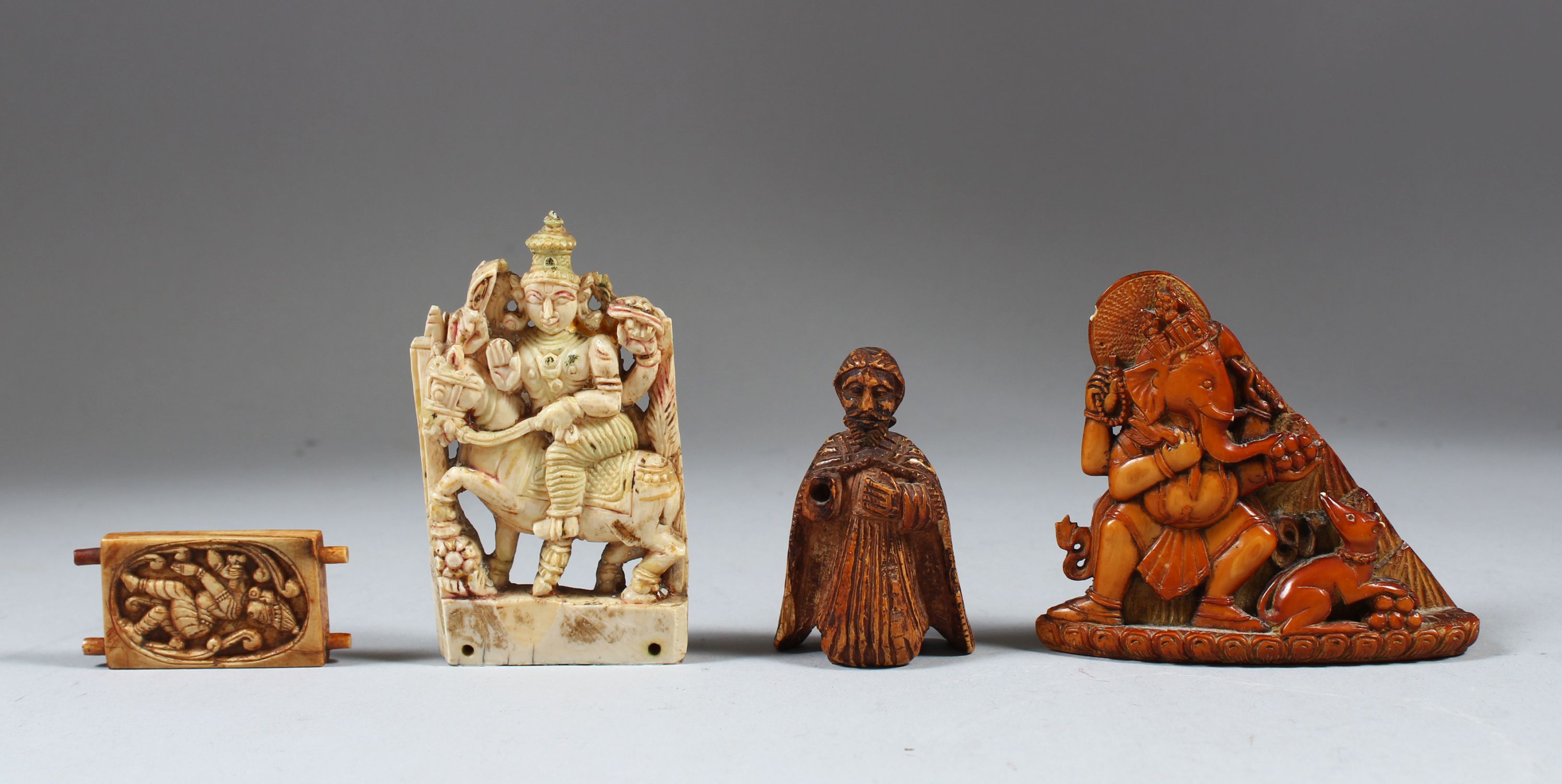 A COLLECTION OF FOUR 17TH-18TH CENTURY SOUTH INDIAN CARVED IVORY PIECES. Depicting Ganesha,