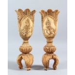 A PAIR OF 19TH CENTURY INDIAN CARVED IVORY TULIP SHAPED VASES, depicting Mughal rulers and consorts,
