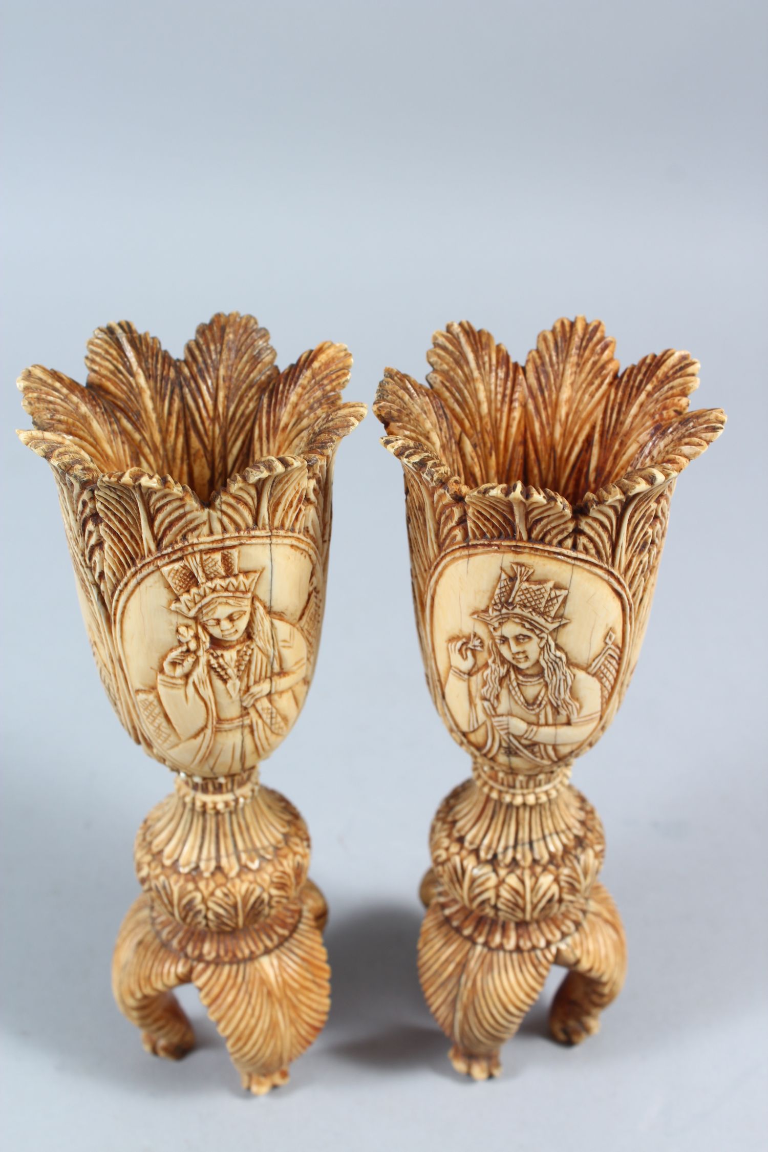 A PAIR OF 19TH CENTURY INDIAN CARVED IVORY TULIP SHAPED VASES, depicting Mughal rulers and consorts, - Image 4 of 8