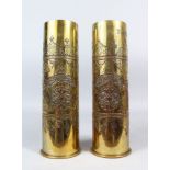 A PAIR OF TRENCH ART BRASS SHELL CASES, PROBABLY FIRST WORLD WAR PERIOD, with Islamic silver and