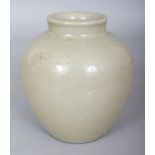 A CHINESE SONG/YUAN STYLE CELADON GLAZED PORCELAIN JAR, 5.25in high.