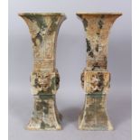 A GOOD PAIR OF CHINESE ARCHAIC JADE VASES. 37cm high.