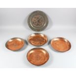 FIVE VARIOUS PERSIAN COPPER CIRCULAR DISHES, 20cm to 28cm diameter.