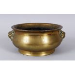 A MING DYNASTY XUENDE PERIOD CIRCULAR BRONZE CENSER, with lion ring handles, 12cm diameter,