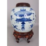 A 19TH CENTURY CHINESE BLUE & WHITE PROVINCIAL PORCELAIN JAR, together with a fitted wood stand