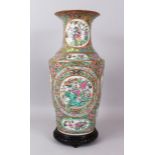 A FINE LARGE CANTON VASE, painted with two large oval panels of birds, butterflies and flowers, with