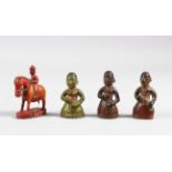 A COLLECTION OF FOUR 18TH CENTURY INDIAN POYCHROME IVORY CHESS PIECES, 5cm high.