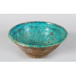 A TURQUOISE GLAZED POTTERY BOWL, PROBABLY AFGHANISTAN, 13TH/14TH CENTURY, 24cm diameter.