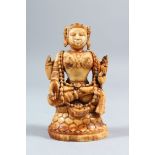 A 17TH-18TH CENTURY SOUTH INDIAN CARVED IVORY FIGURE OF A GODDESS, sitting on a lotus throne, 11cm