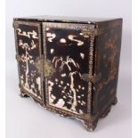 19TH CENTURY CHINESE LACQUER AND MOTHER OF PEARL TABLE CABINET, the double panelled doors open to