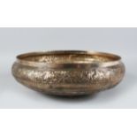 A 19TH CENTURY MALAY SILVER CIRCULAR BOWL, 32cm diameter, 11ozs in weight.