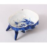 A SMALL MEIJI BLUE AND WHITE SATYR MASK BRUSH WASHER. 8cm long.