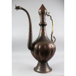 A LARGE 19TH CENTURY INDIAN KASHMIRI COPPER EWER, signed and dated 1885, 70cm high.