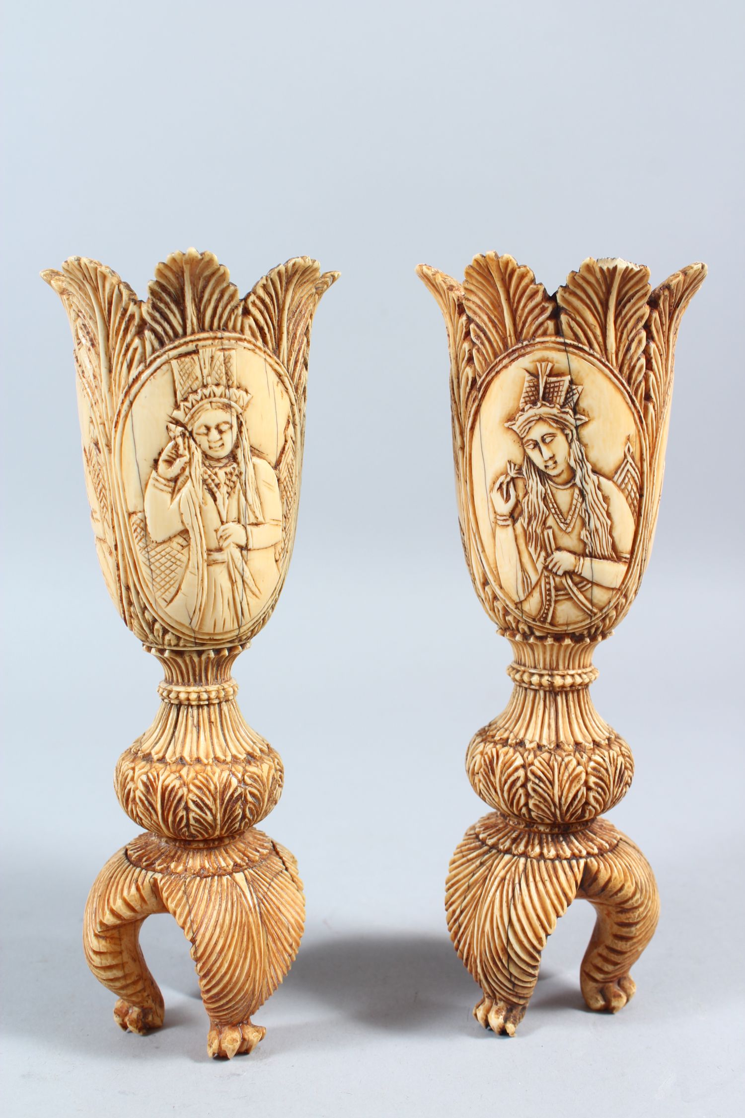 A PAIR OF 19TH CENTURY INDIAN CARVED IVORY TULIP SHAPED VASES, depicting Mughal rulers and consorts, - Image 2 of 8