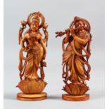 A PAIR OF INDIAN CARVED IVORY FIGURES OF STANDING GODDESSES, 14cm high.