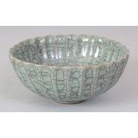 A CHINESE CELADON CRACKLEGLAZE FLUTED PORCELAIN BOWL, the base with a moulded character mark, 4.