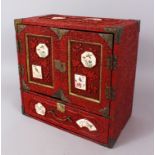 AN UNUSUAL JAPANESE CINNABAR LACQUER TABLE CABINET WITH SATSUMA PANELS, the front and top inset with
