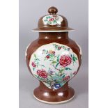 A LARGE CHINESE CAFE AU LAIT GINGER JAR AND COVER, painted with panels of flowers. 40cm high.