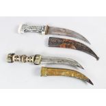 TWO 19TH CENTURY CAUCASIAN DAGGERS, with later alterations, 34cm long.