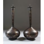 A GOOD PAIR OF 19TH CENTURY INDIAN KOFTGARI LIDDED BOTTLES (SURAHI), iron, inlaid with gold and