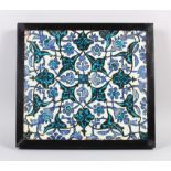 A SUPERB 16TH CENTURY DAMASCUS GLAZED POTTERY TILE, in a wooden frame, 31cm square.