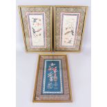 A SET OF THREE CHINESE SILK PICTURES, framed and glazed, 43cm x 25cm.