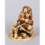 A GOOD QUALITY JAPANESE IVORY OKIMONO OF DRAGONS AND GODS, depicting Ebisu with his mallet and