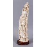 A LARGE CHINESE CARVED IVORY FIGURE OF LONGEVITY GOD SHOU ZIAN, stood holding his staff with an