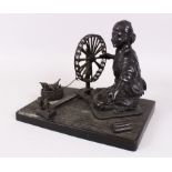 A GOOD MEIJI BRONZE OF A WOMAN SPINNING COTTON. 27cm long, 19cm wide, 23cm high.