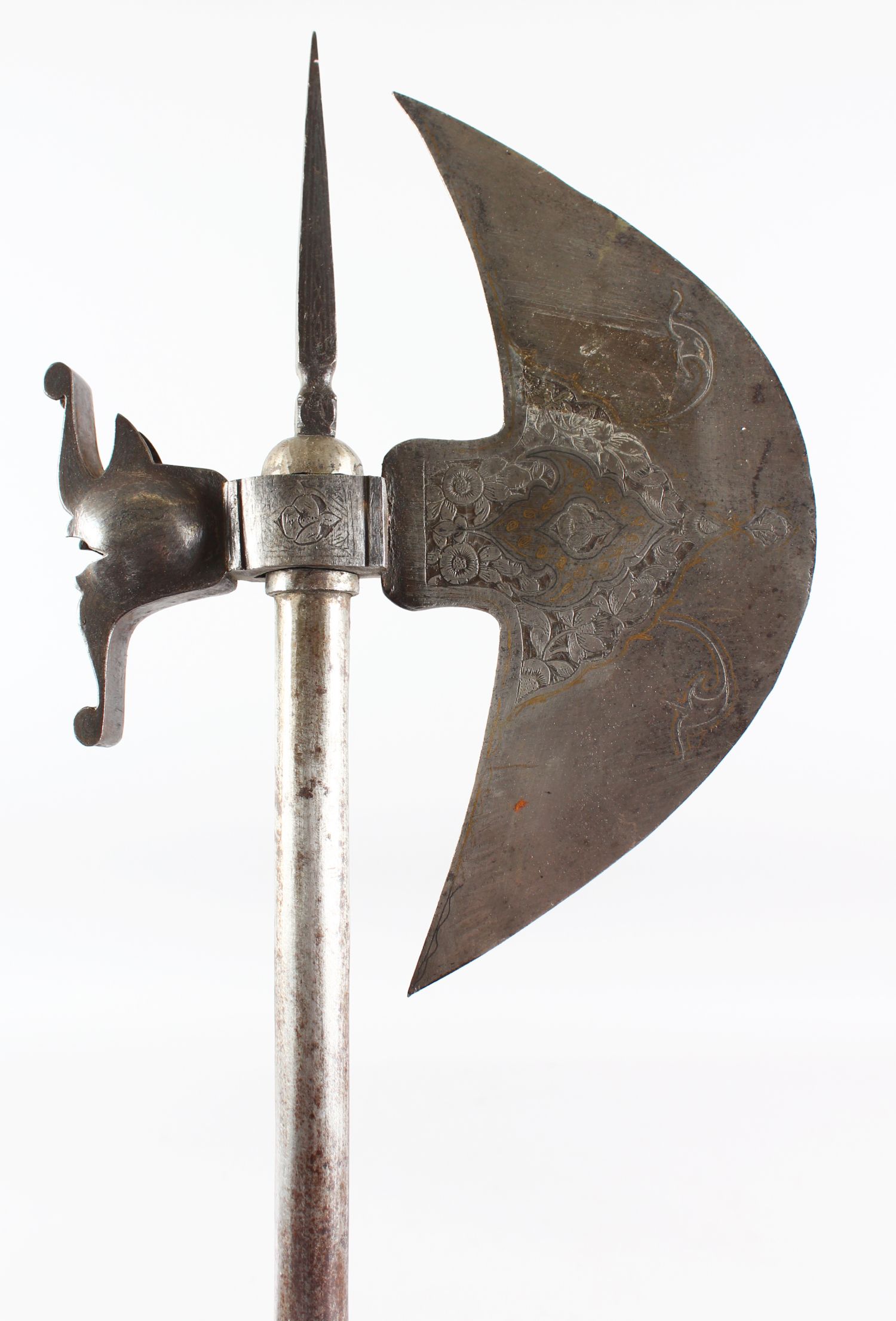 A 19TH CENTURY PERSIAN QAJAR GOLD INLAID STEEL AXE, 76cm long.