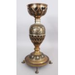 A BRASS LAMP, PROBABLY MORADABAD, NORTHERN INDIA, CIRCA 1920-30, the bulbous body formed around a