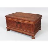 A 19TH CENTURY BOMBAY CARVED SANDLEWOOD BOX AND COVER, with fitted interior supported on four claw