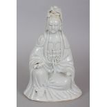 AN 18TH CENTURY CHINESE BLANC-DE-CHINE PORCELAIN FIGURE OF GUANYIN, seated in meditation and bearing