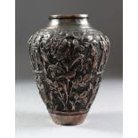 A PERSIAN SHIRAZ SILVERED COPPER VASE, repousse with flowers, birds and figures, 16cm high.