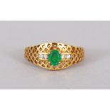 AN 18CT GOLD, DIAMOND AND EMERALD RING.