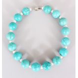 A LONG TURQUOISE AND PEARL NECKLACE.