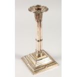 AN OLD SHEFFIELD PLATE CLUSTER COLUMN CANDLESTICK, on a square base. 10.5ins high.