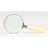 A MAGNIFYING GLASS, with mother-of-pearl handle. 7.5ins long.