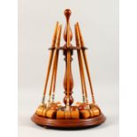 A LATE 19TH CENTURY MAHOGANY AND BOXWOOD TABLE CROQUET SET, comprising a turned mahogany stand,