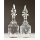 A PAIR OF CUT GLASS MALLET SHAPE DECANTERS, with spire shaped stoppers. 11ins high.