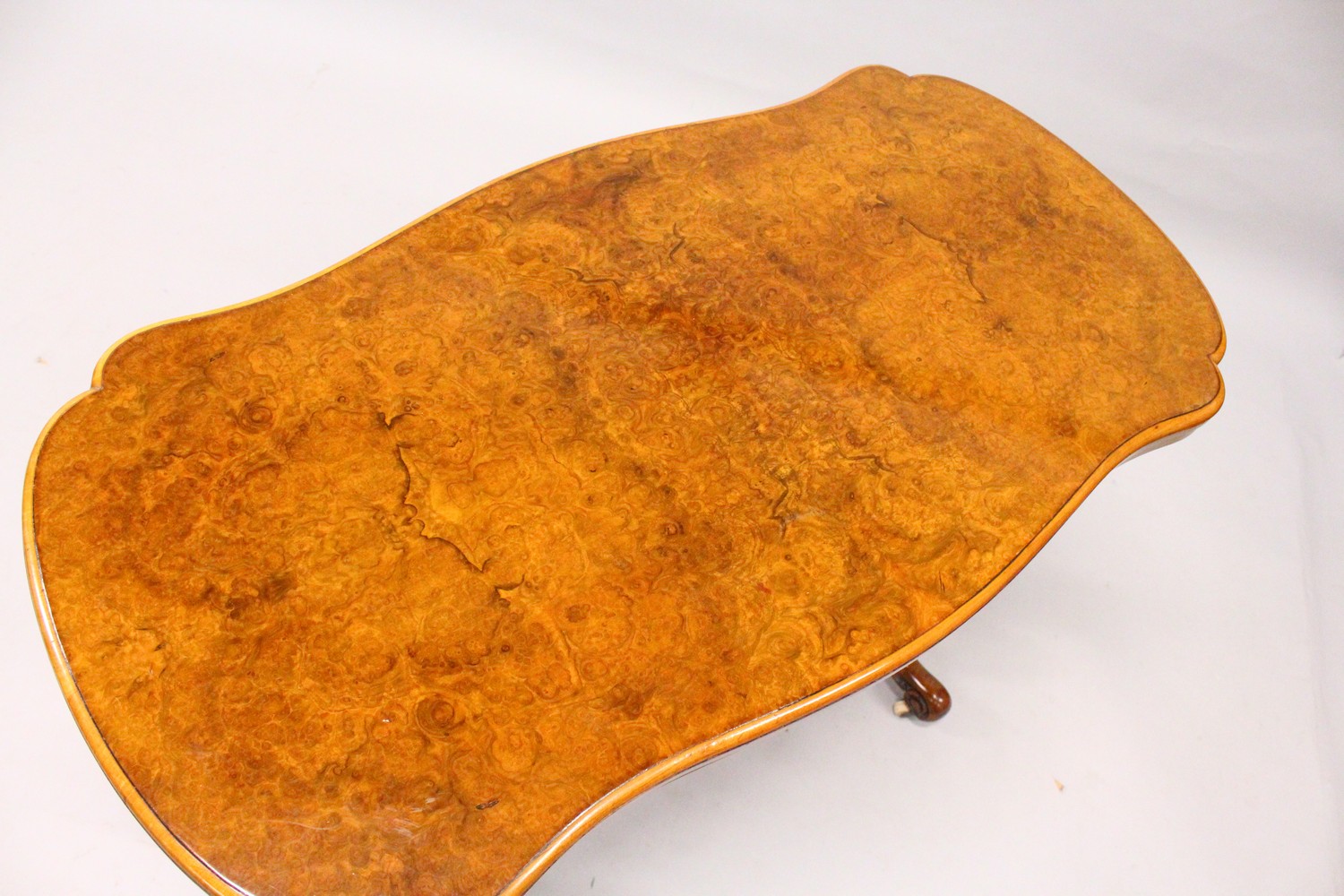 A GOOD VICTORIAN BURR WALNUT SHAPED TOP FOLDOVER CARD TABLE, with a pair of turned and carved column - Image 4 of 12