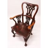 A CHIPPENDALE DESIGN TALL BACK AMERICAN ARMCHAIR with pierced vase splat, curving arms and solid