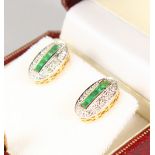 A PAIR OF 9CT GOLD CALIBRE CUT EMERALD EARRINGS.