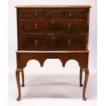 AN 18TH CENTURY STYLE WALNUT CHEST ON STAND, with three graduated long drawers, on a stand with